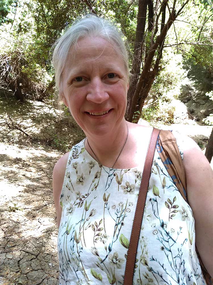 Photo of Lissa Walsh of Divine Assist Mentoring in the woods